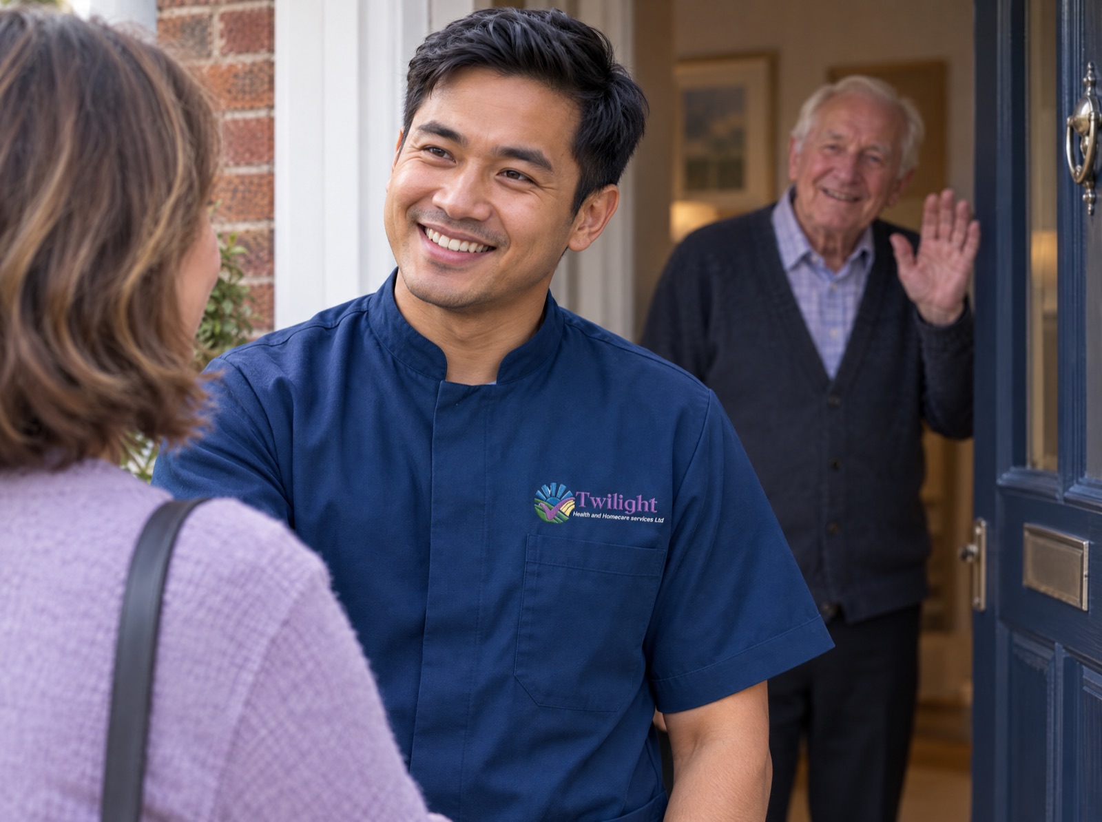 Asian heritage Twilight carer in a twilight-blue uniform arriving to provide respite care so a family carer can take a break